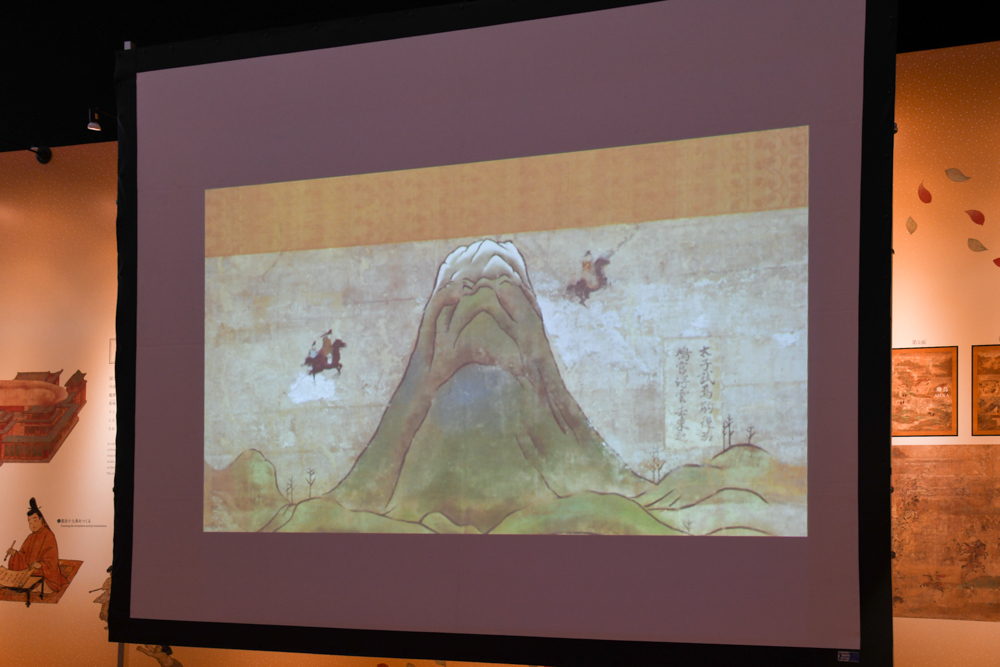 「黒駒（くろこま）で空を飛んで富士山へ」の例。東（画面右）から馬に乗ったアニメーションの太子が飛んでくる
