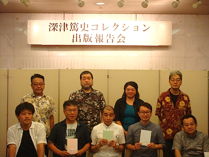 記者発表より 　前列左から・平塚直隆、中村賢司、橋本健司、笠井友仁、はしぐちしん　後列左から・岩崎正裕、キタモトマサヤ、高橋恵、はせひろいち