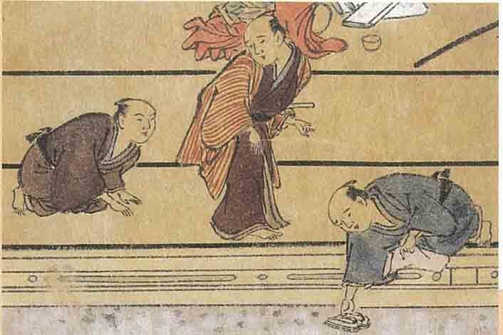 お見送りをする番頭と下足番